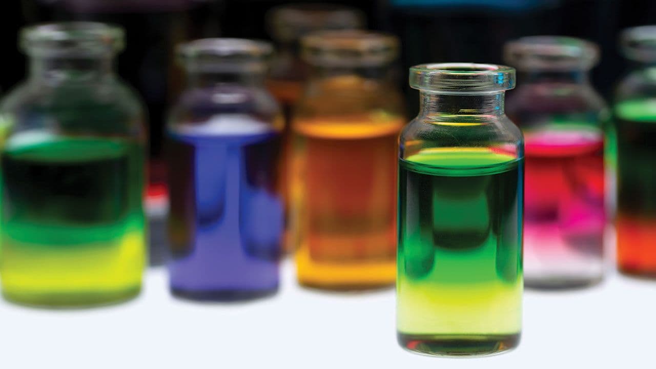 Colored water in small glass containers on white background | Image Credit: ©Baharlou/Stock.Adobe.com