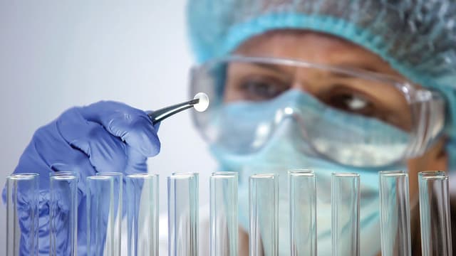 Researcher holding tablet, conducting medication quality control, effectiveness | Image Credit: ©motortion - stock.adobe.com