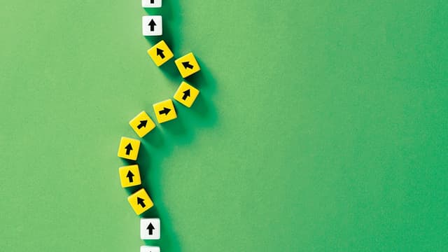 Flexibility and adaptation concept. Arrows on cubes following a flexible path | Image Credit: © Cagkan - stock.adobe.com