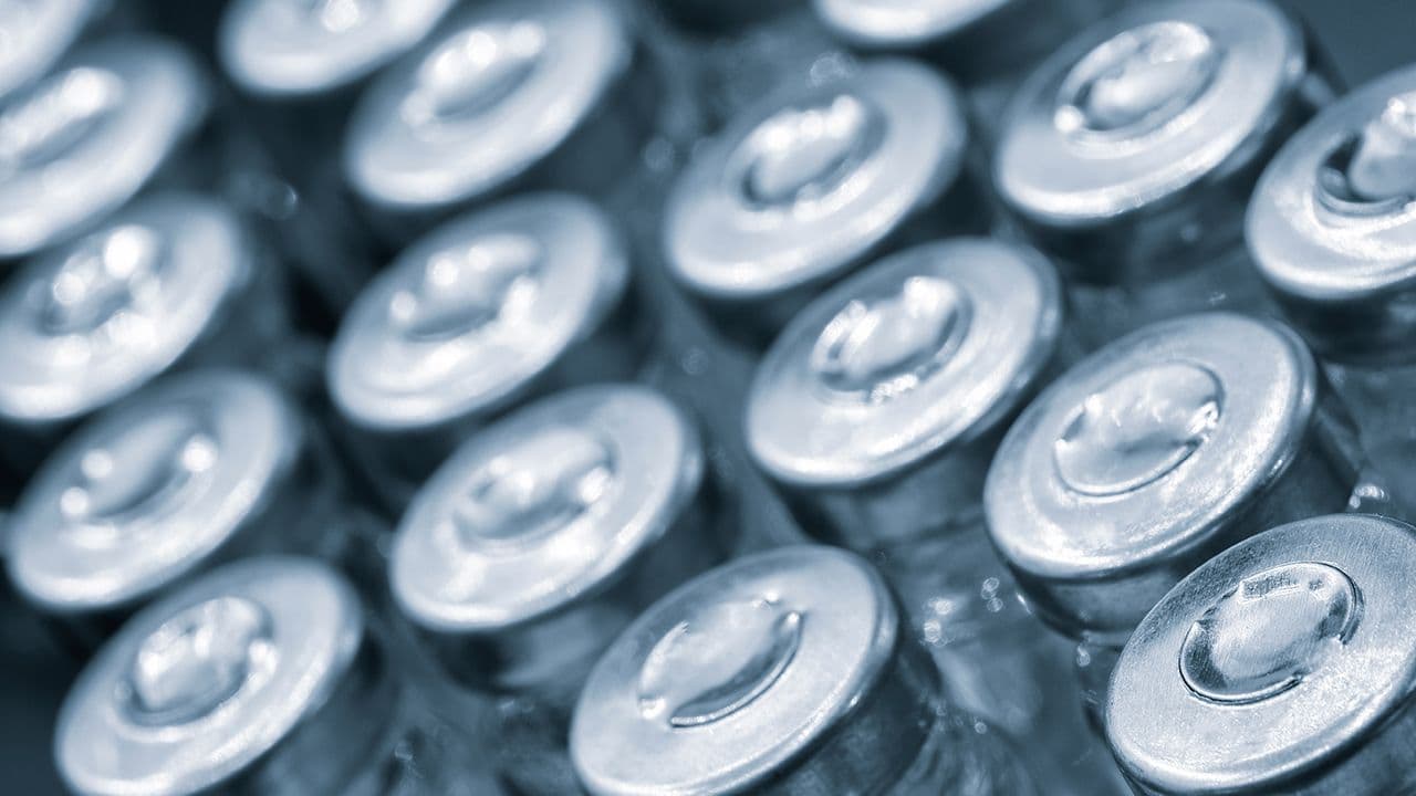 Pharmaceutical industry. Production line machine conveyor with glass bottles ampoules at factory. Pharmaceutical industry concept background | Image Credit: © Aleksandr Matveev - Stock.Adobe.com