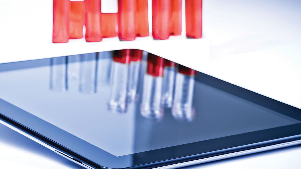 modern digital tablet pc near test tube in laboratory | Image Credit: ©donfiore - stock.adobe.com